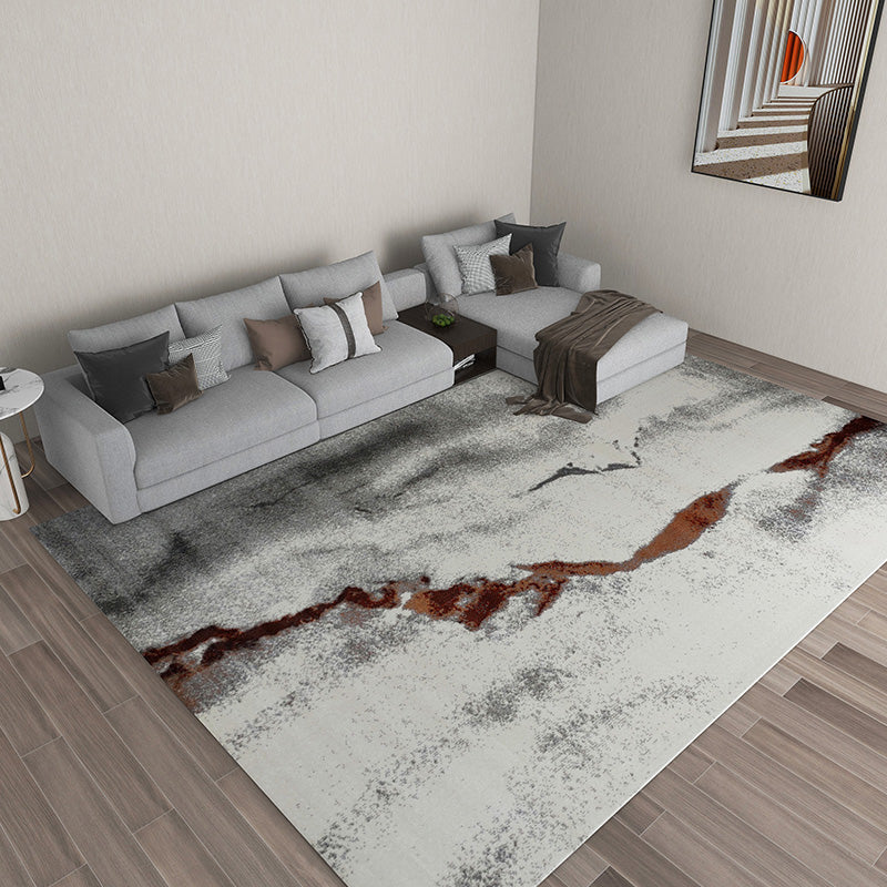 Iris Abstract Textured Rug in gray and rust, ideal for modern washable home decor.