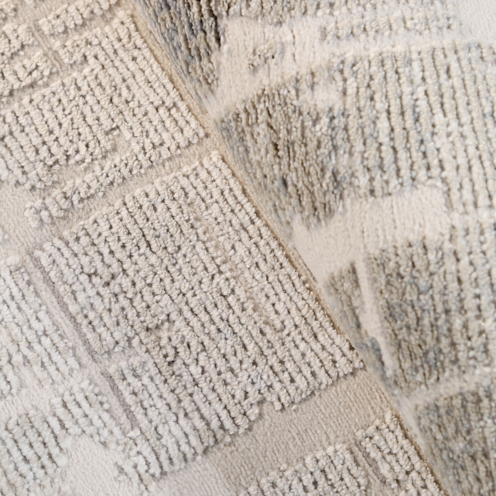 Close-up of Fading Embers modern woven rug with gray geometric pattern.