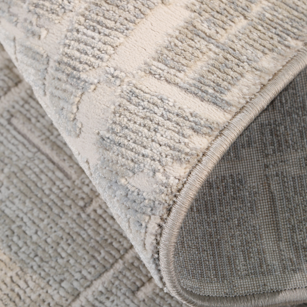 Textured gray and white Fading Embers modern woven rug corner detail