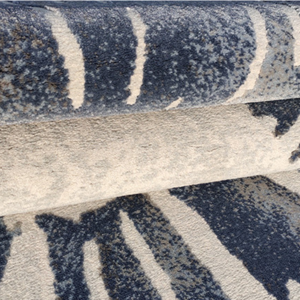 Poppy Abstract Textured Rug Arith in blue and cream, showcasing its unique texture.