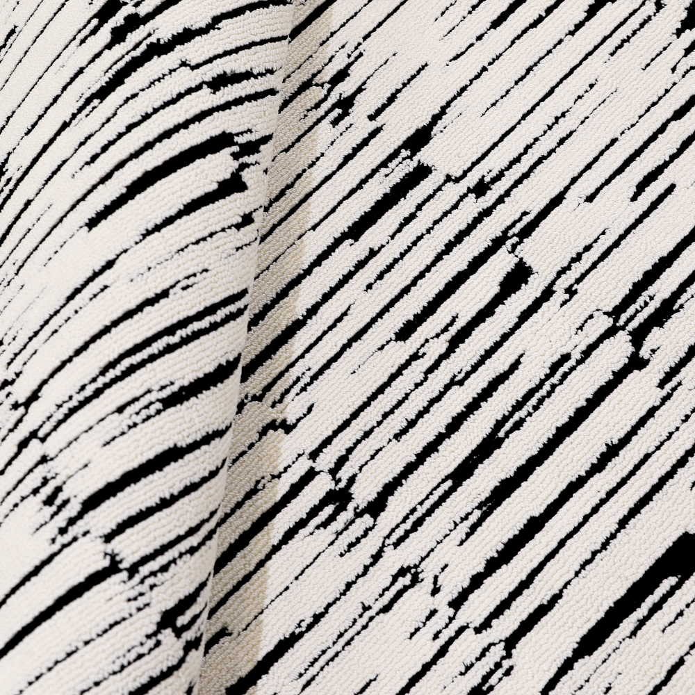 Textured black and white Shattered Illusions modern woven rug close-up.