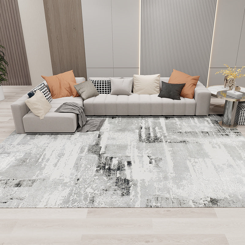 Skye Abstract Textured Rug in gray and white enhancing a modern living room style