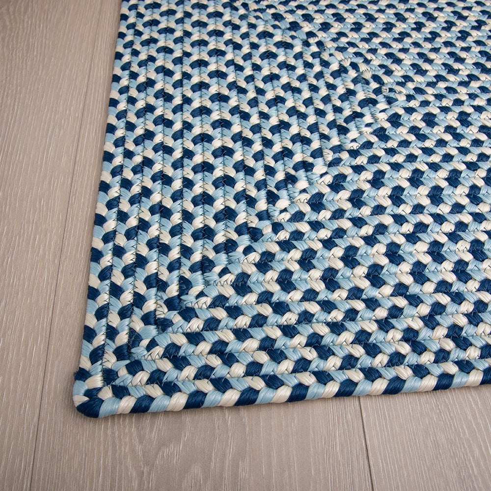 Hand-braided blue and cream rug enhancing modern interior decor.
