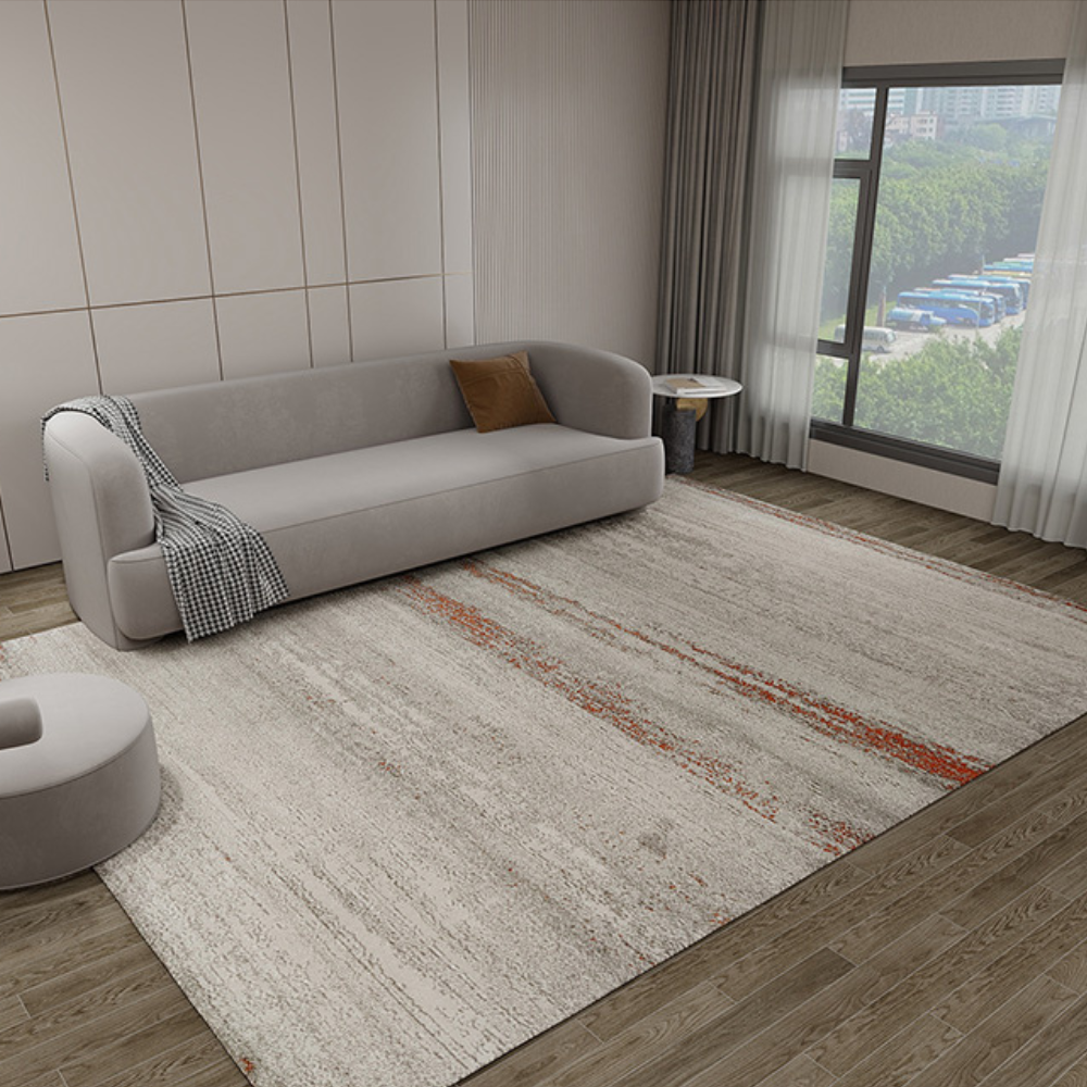 Leo Abstract Textured Rug in gray with orange accents in a modern living room