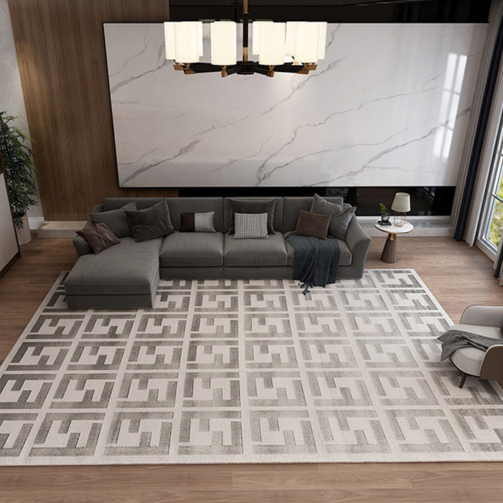 Modern geometric gray rug with interlocking design in a stylish living room.