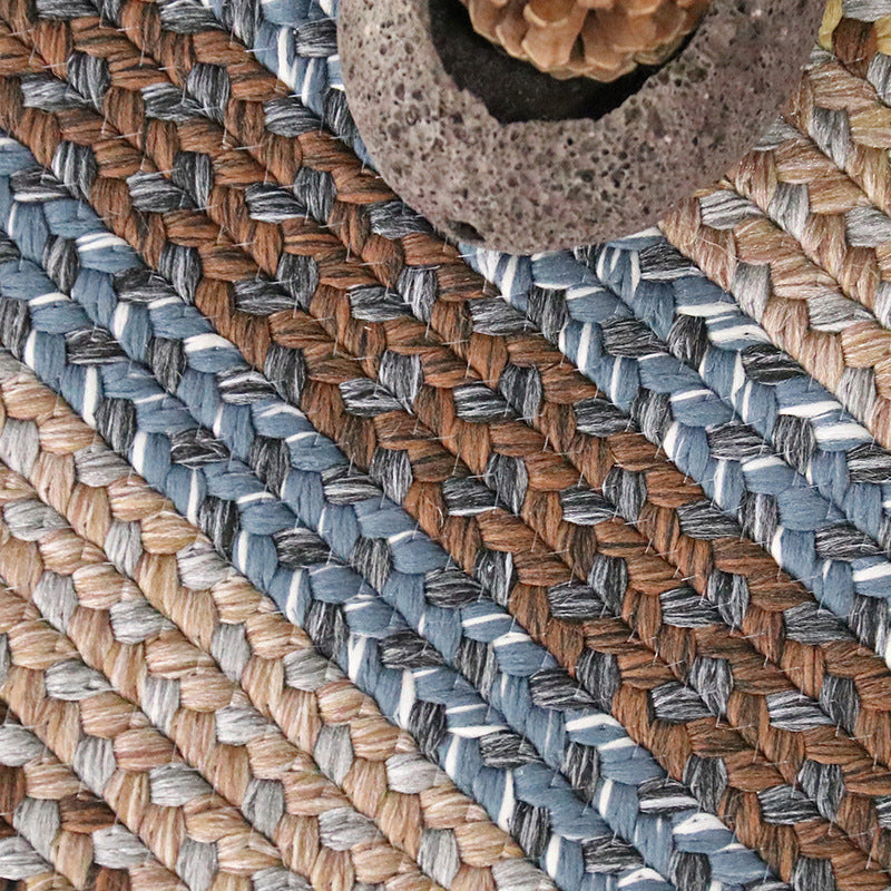 Textured Ringed Circle Vintage Outdoor Woven Rug in earth tones for stylish outdoor decor.