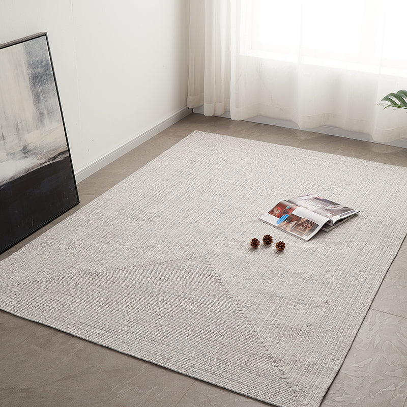 Hand-woven grey outdoor rug, customizable size, perfect for elegant outdoor spaces.