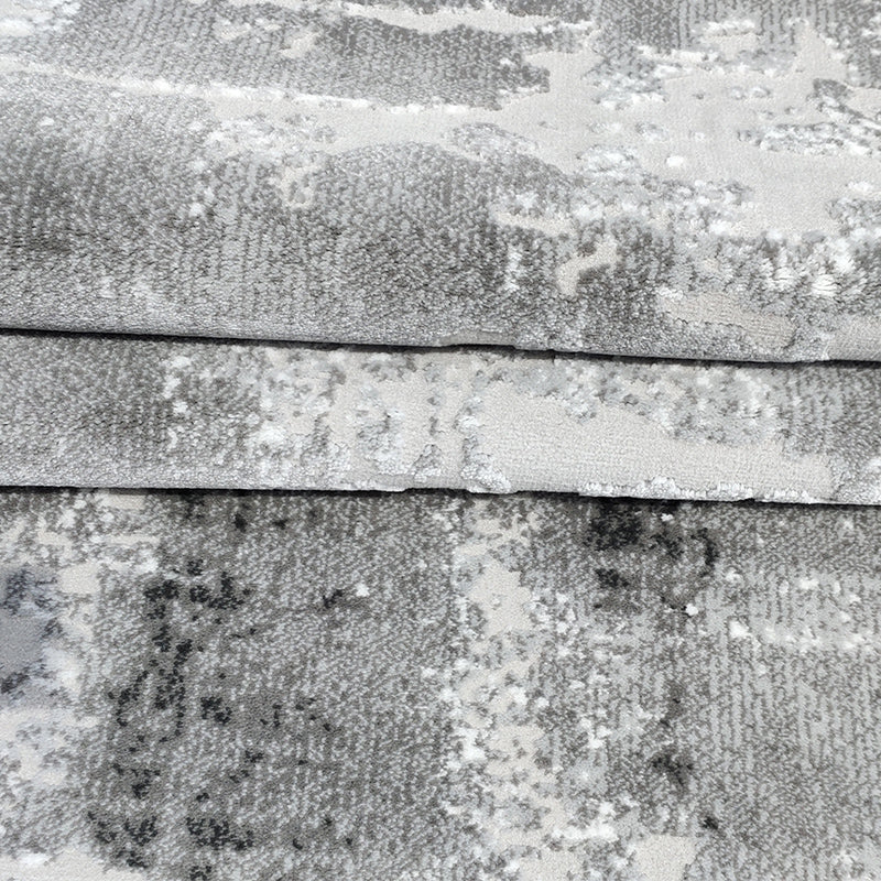 Skye Abstract Textured Rug in soft gray and white, perfect for modern home interiors.