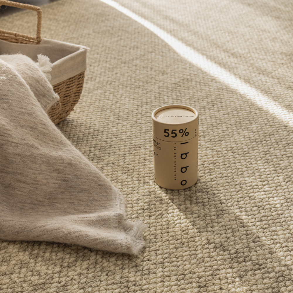 Golden Path Soft Woven Rug with a basket and throw in a sunlit room
