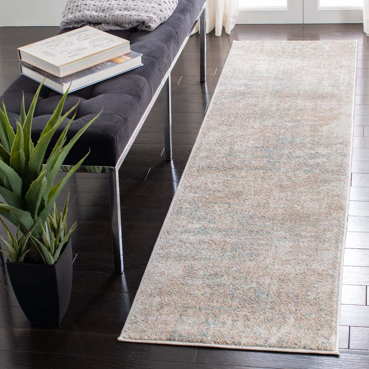 Harmonious Sunset Seren runner rug in soft neutrals and blue accents beside modern decor.
