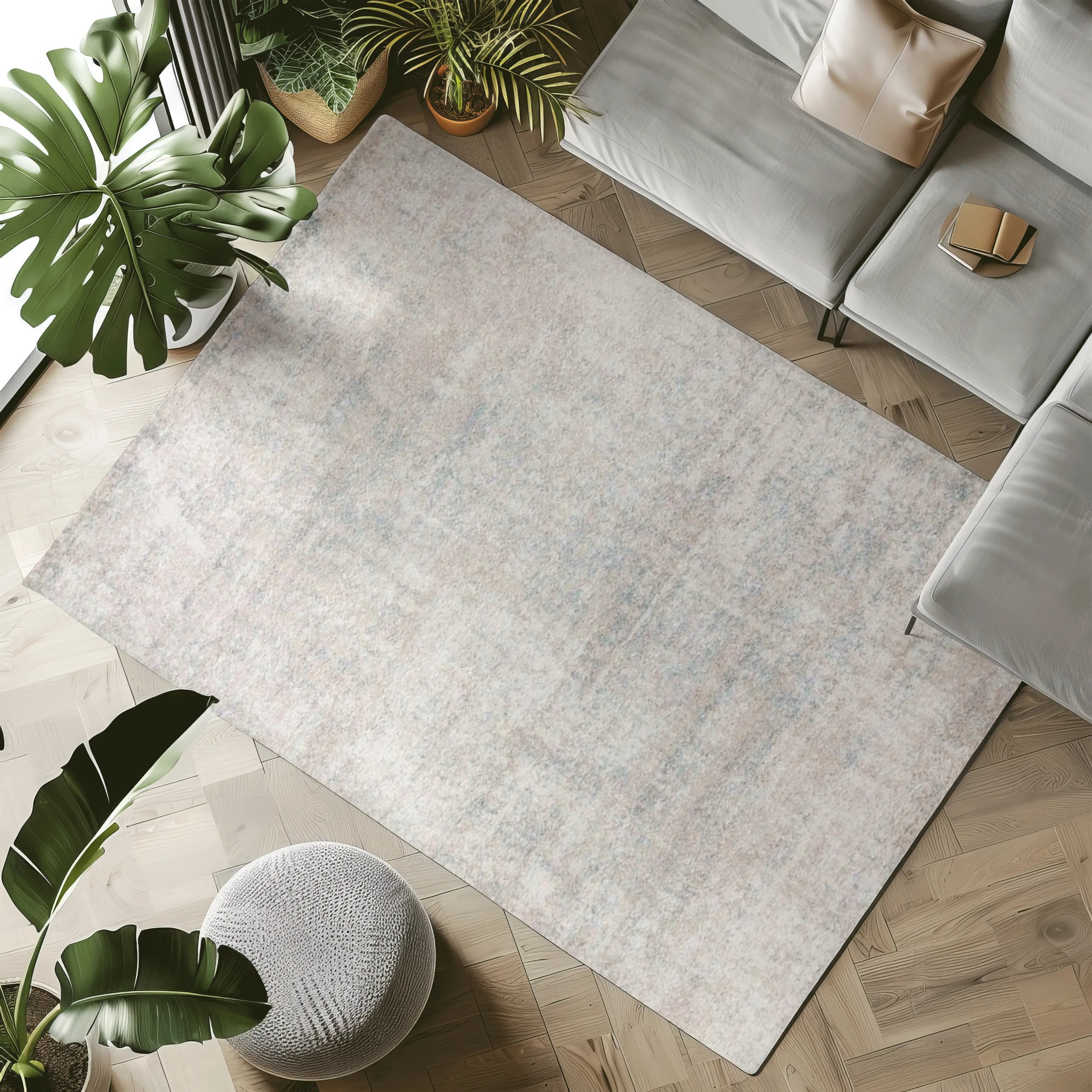 Harmonious Sunset Seren rug in neutral tones and blue accents in a modern living room.