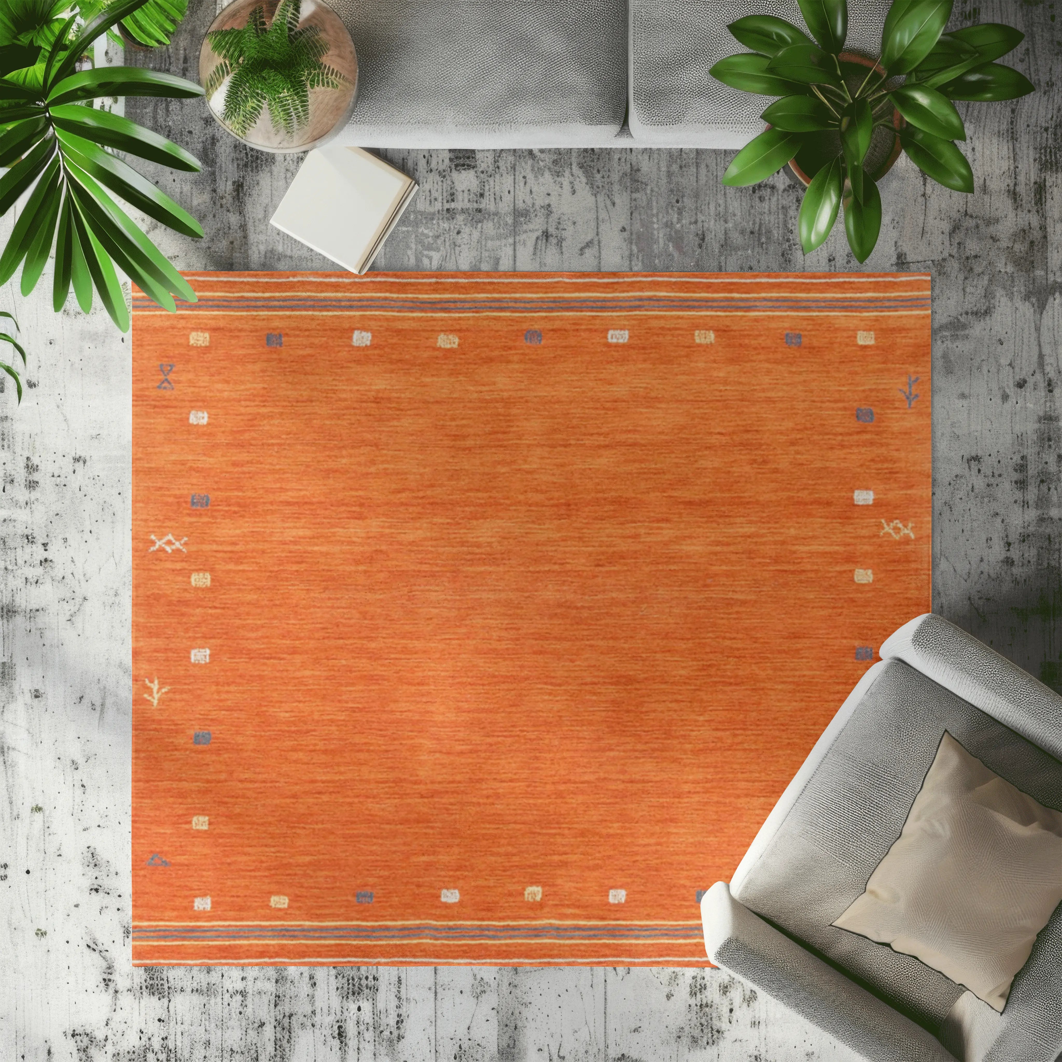 Vibrant orange geometric rug with blue and cream accents in modern living room