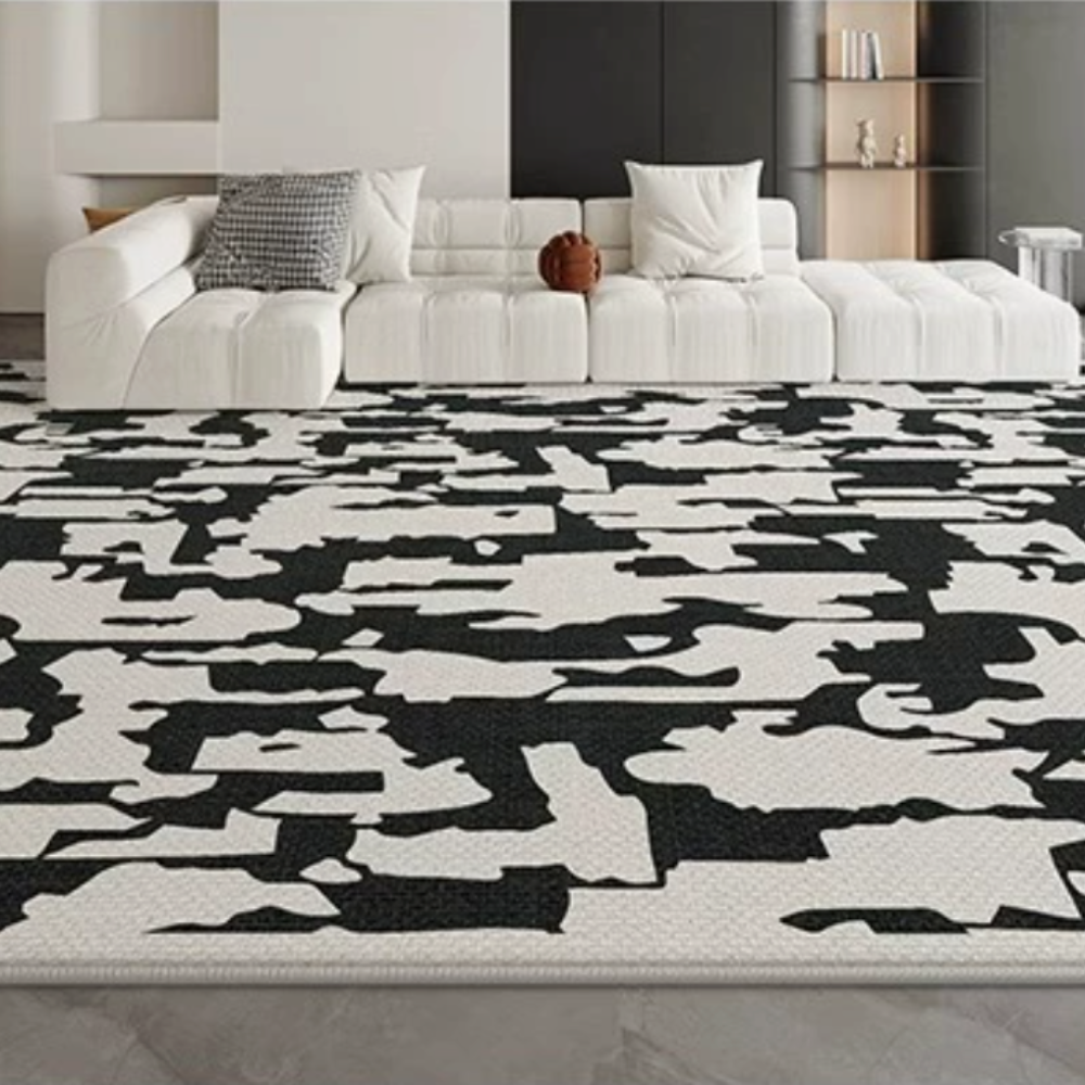 Abstract black and white Evadne washable rug in modern living room setting