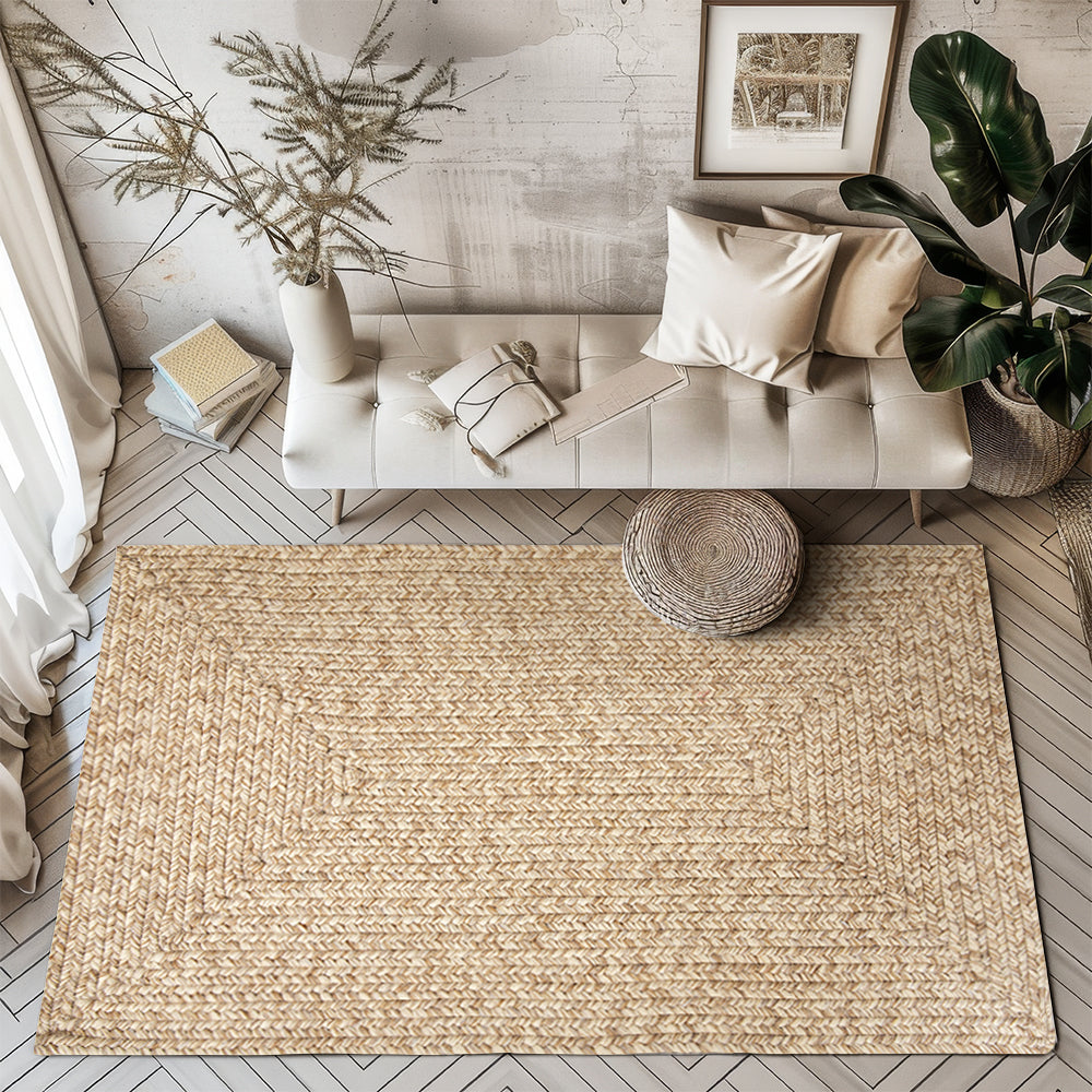 Beige outdoor rug with intricate hand-braided texture in modern living room setting