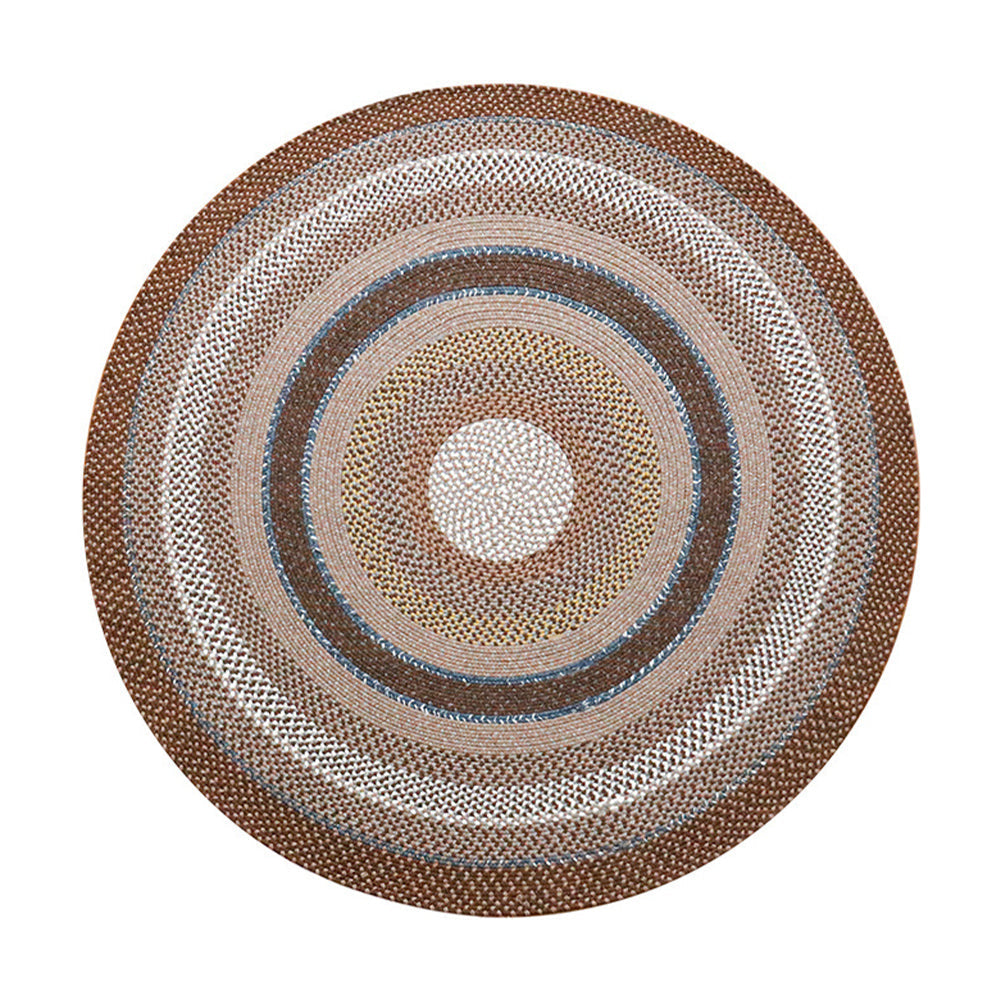 Vintage woven rug with circular patterns in multi-color for outdoor use.