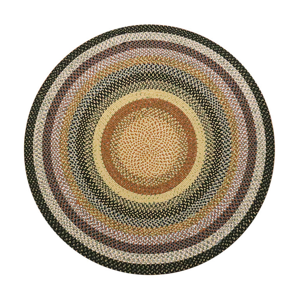 Round Faith Bohemian outdoor woven rug with colorful concentric patterns.