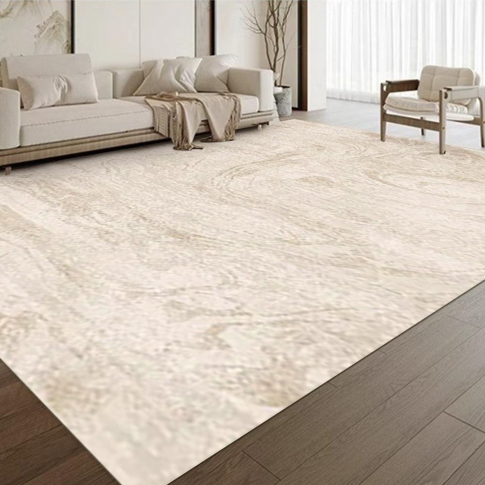 Golden Whisper Modern Rug in light beige marble design on dark wood floor.