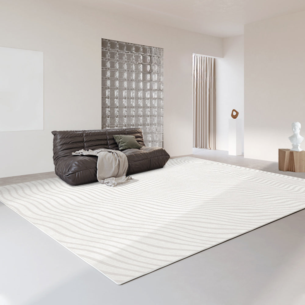 Crystal Whisper modern rug with wave pattern in a bright, minimalist living room.