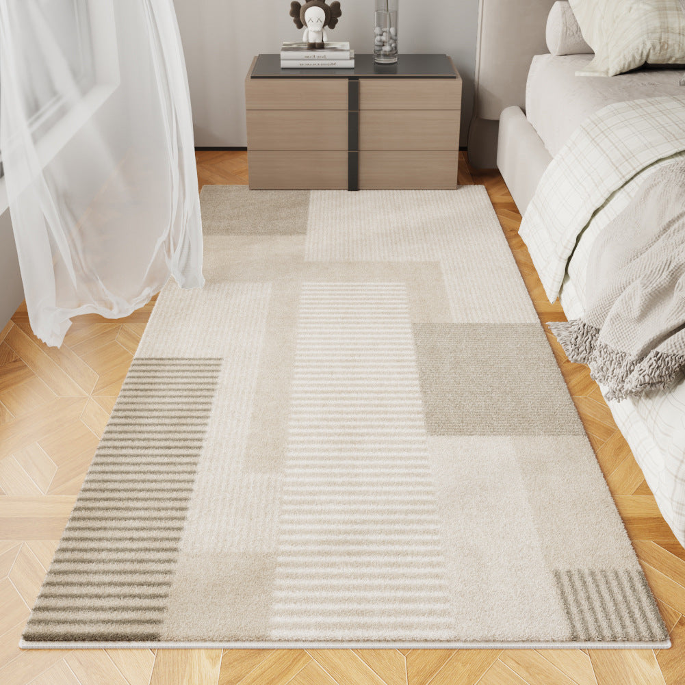 Urban Layers geometric rug in soft beige tones on a modern bedroom floor
