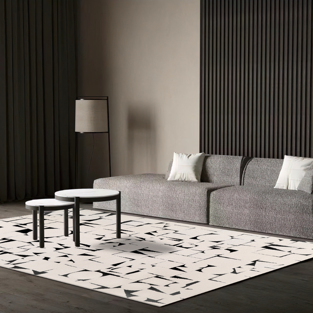 Geometric black and white modern rug in stylish living room setting