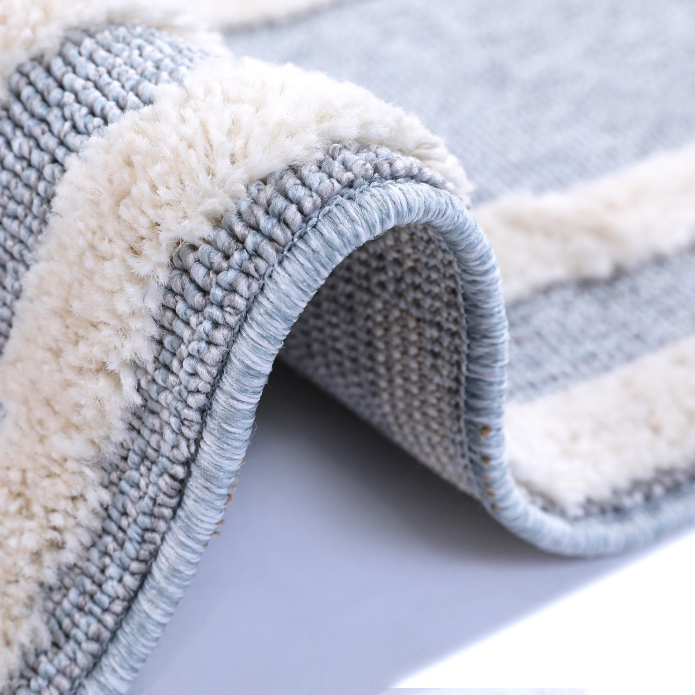 Soft gray Veiled Dreams Kids Woven Rug with plush texture for cozy play areas.