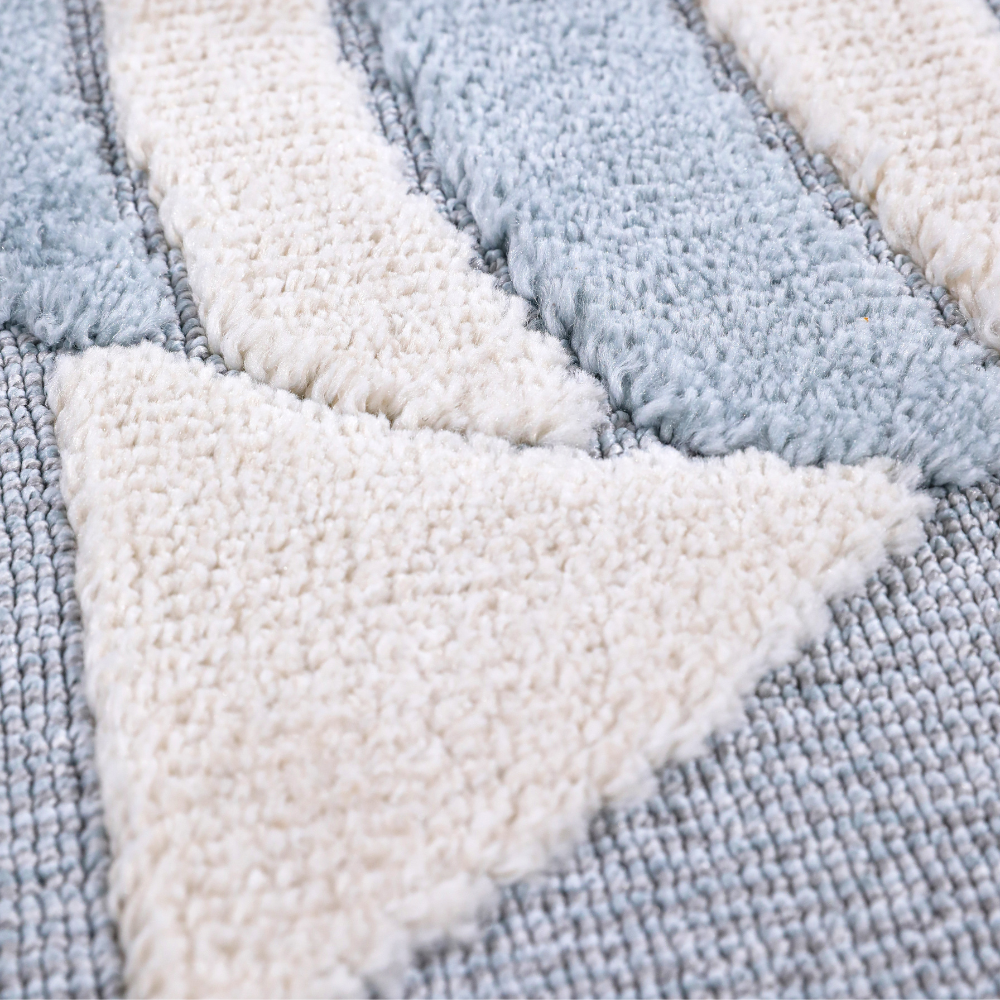 Soft textured kids rug featuring blue and cream abstract design for playful decor.