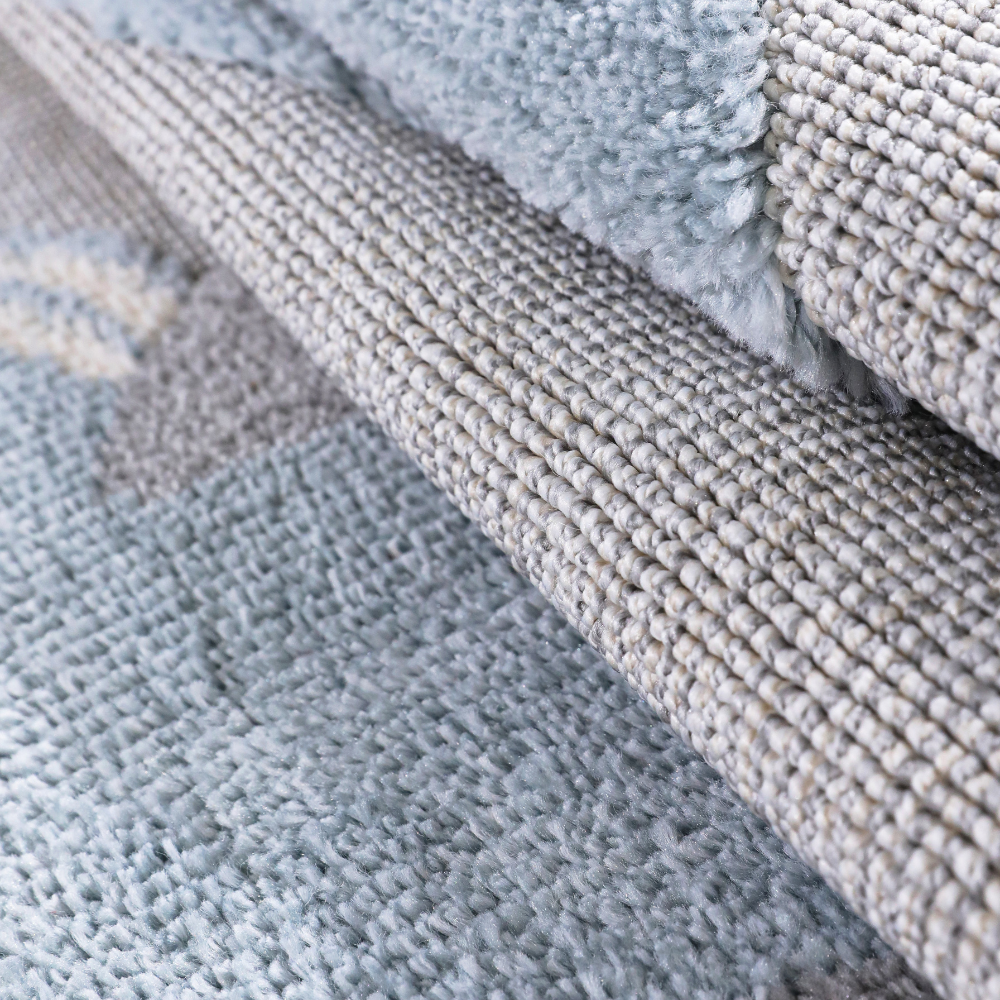Gentle Tides Whale Woven Rug detail emphasizing soft textures and calming pastel colors.