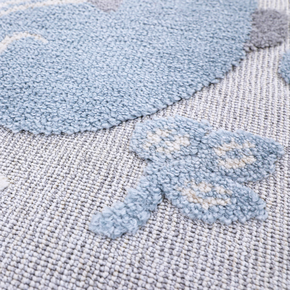 Gentle Tides Whale Rug close-up with soft textures and pastel whale design.