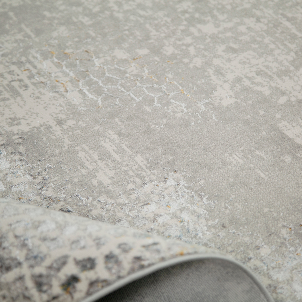 Elegant gray textured rug with honeycomb pattern for contemporary home styling.