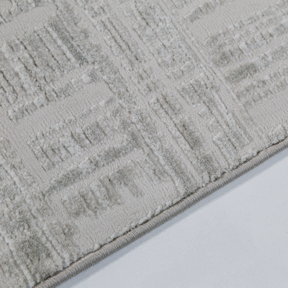 Textured cream and beige Melody Strip Rug with geometric design.