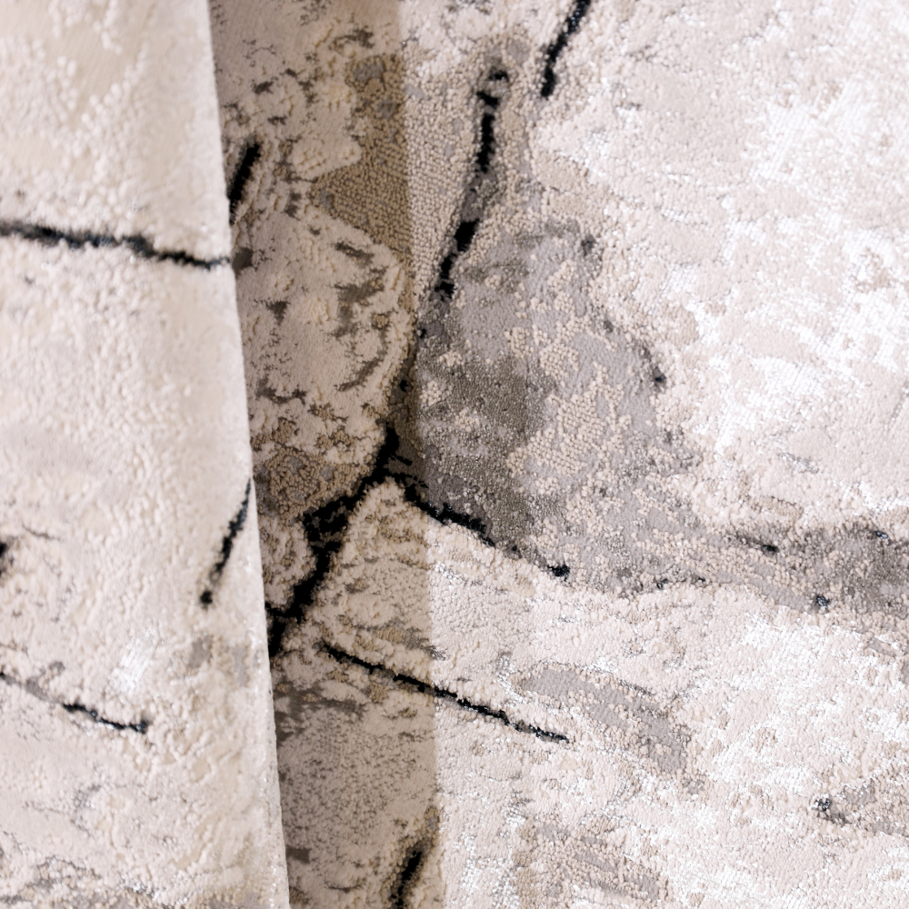 Leif Abstract Textured Rug in soft beige and gray tones for modern decor.