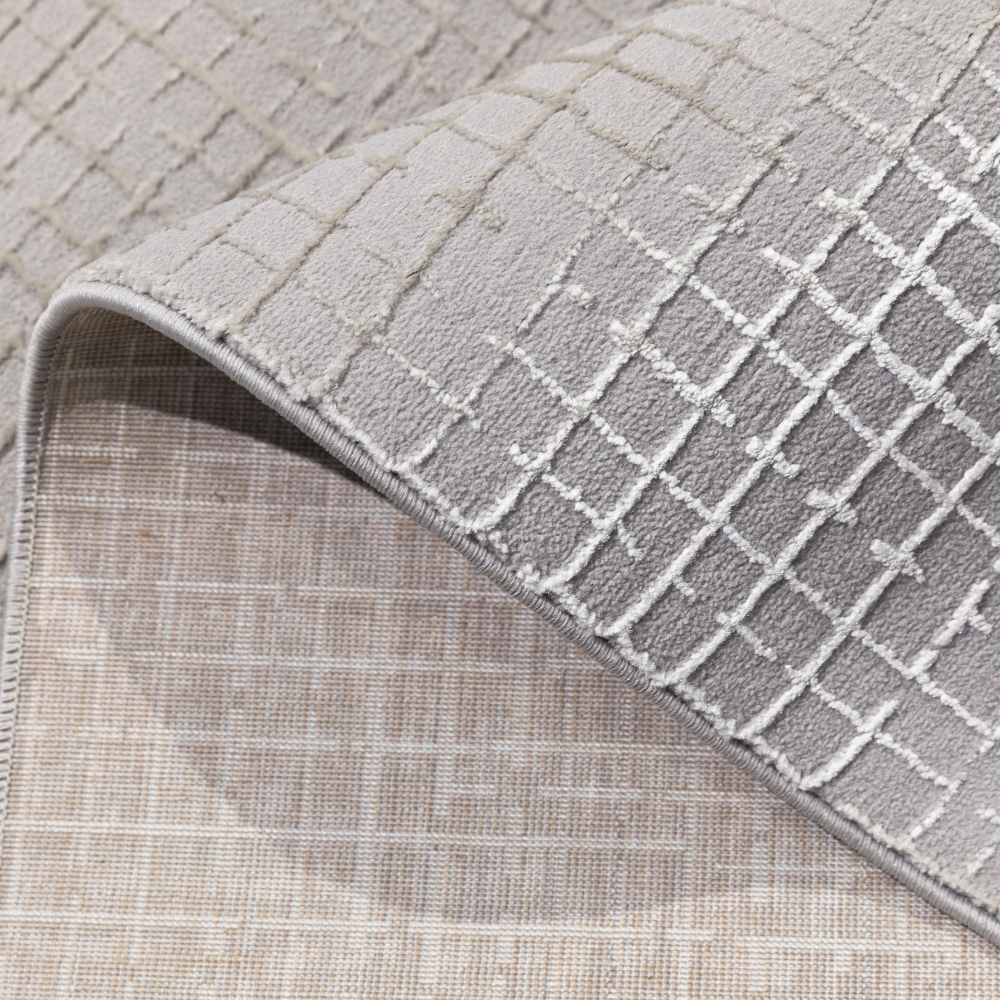 Lyra Checkered Textured Rug with soft gray pattern, ideal for modern interiors.