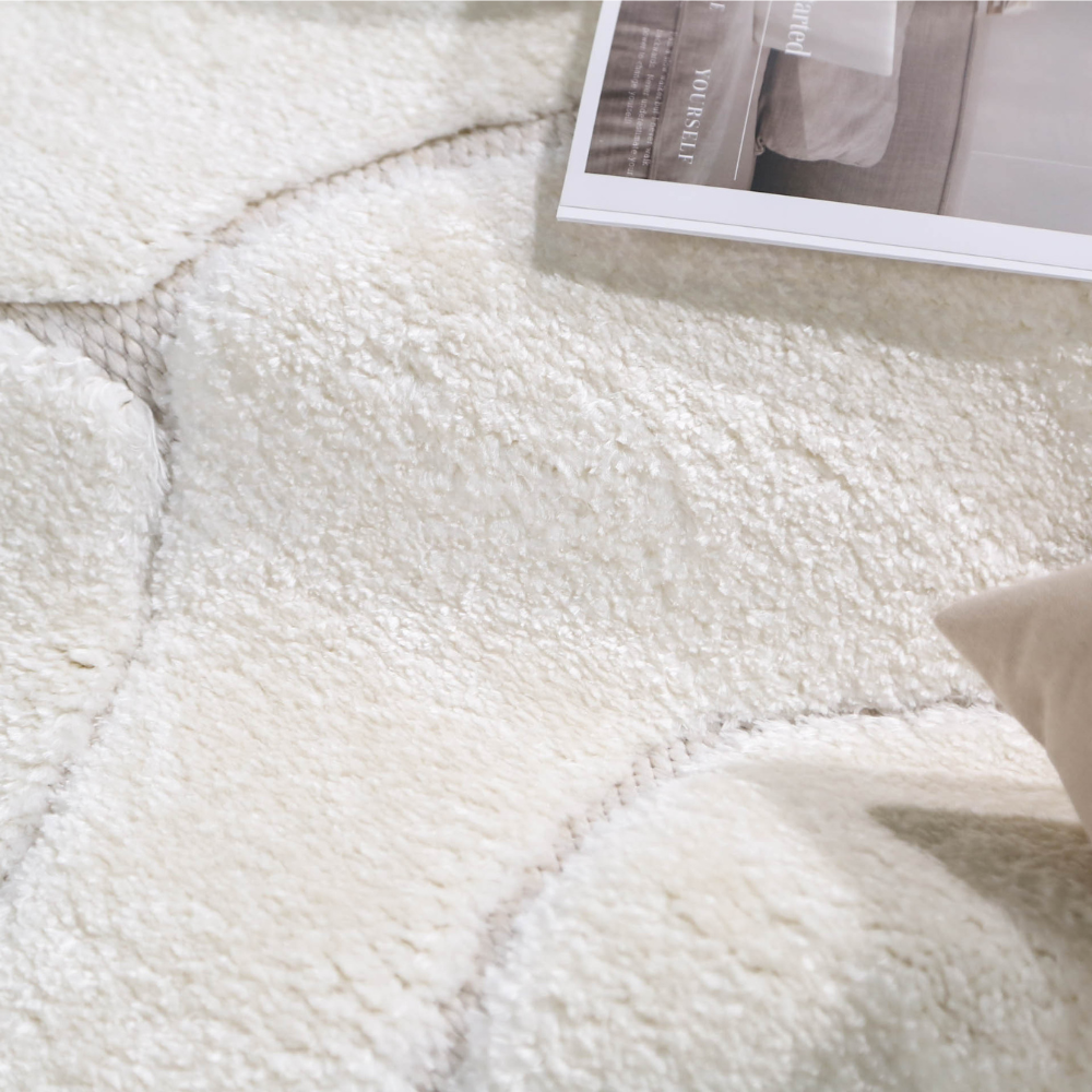 Cream Nyx geometric textured rug with wavy patterns for modern home styling.