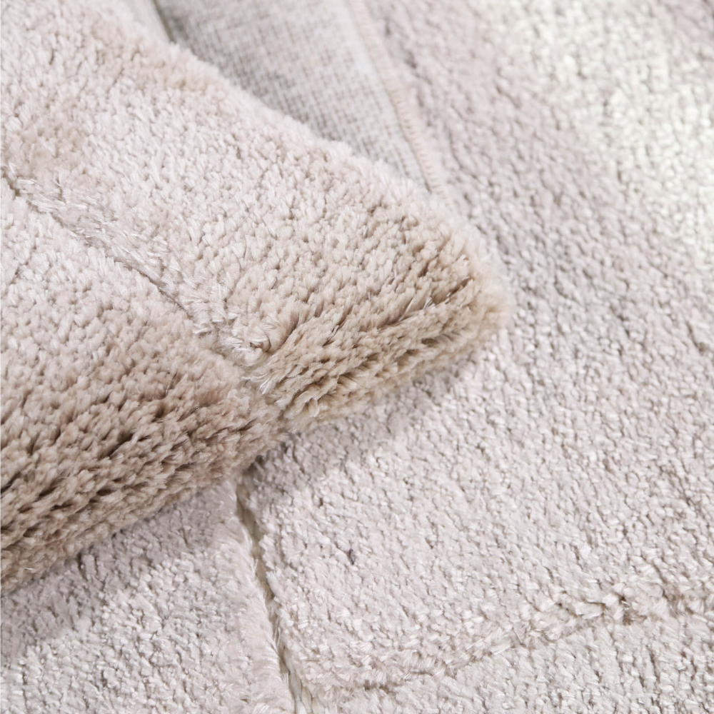 Soft beige geometric rug texture perfect for modern home interiors.