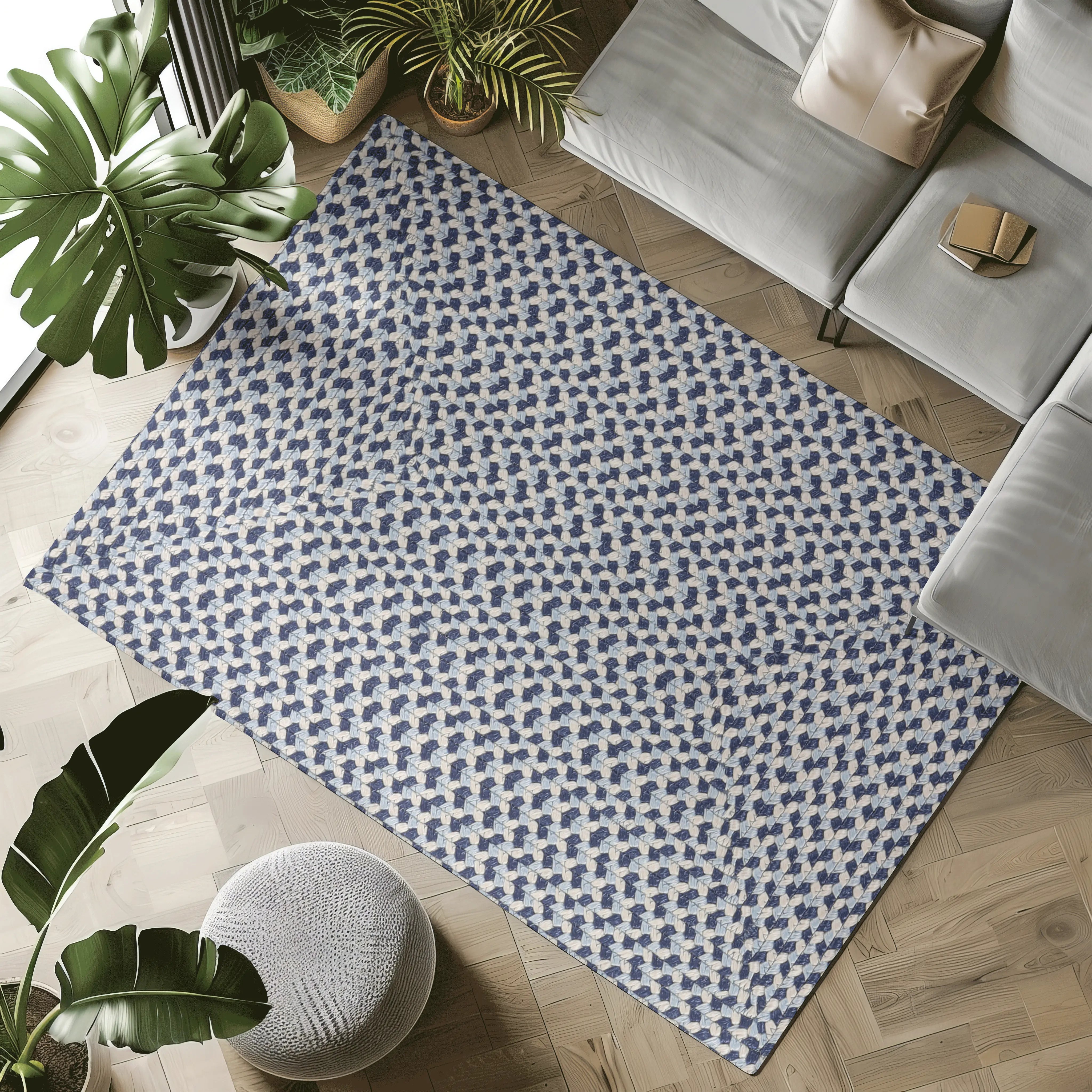 Blue and cream hand-braided rug in living room setting