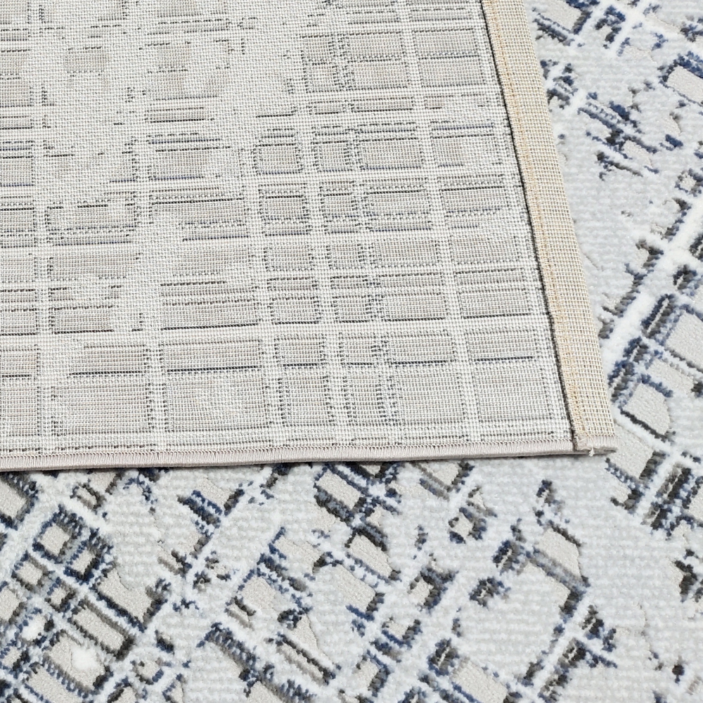 Felix Abstract Textured Rug with blue and white geometric design, perfect for modern decor.