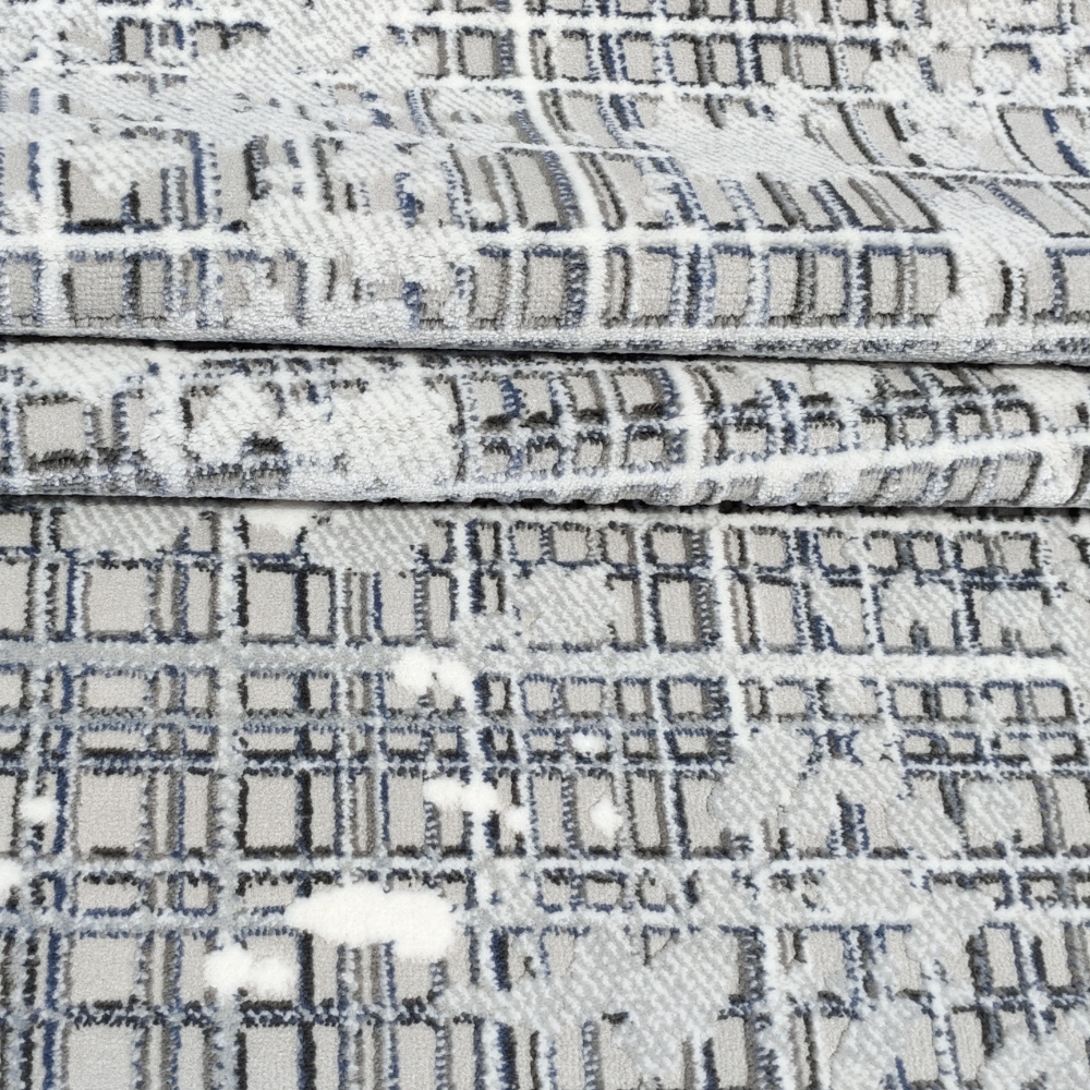 Felix Abstract Textured Rug with modern blue and white geometric design, perfect for stylish homes.