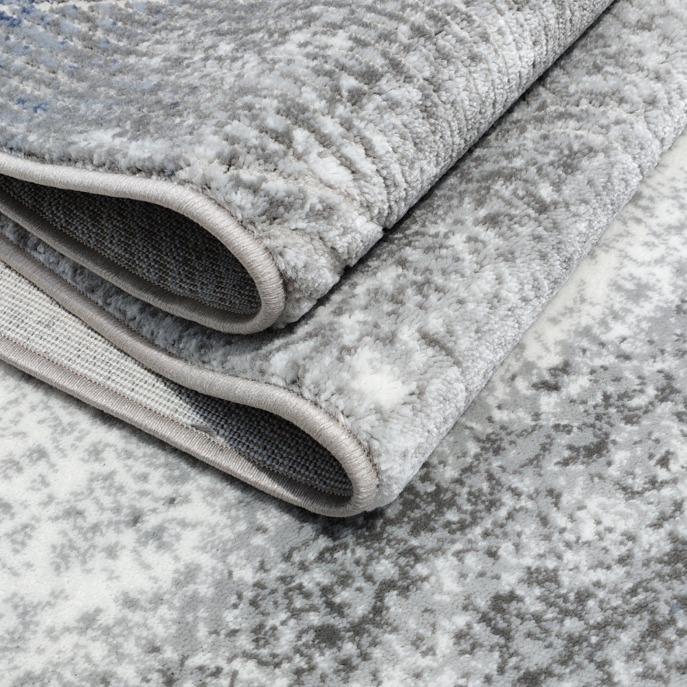 Wynn Abstract Textured Rug featuring soft gray and blue design