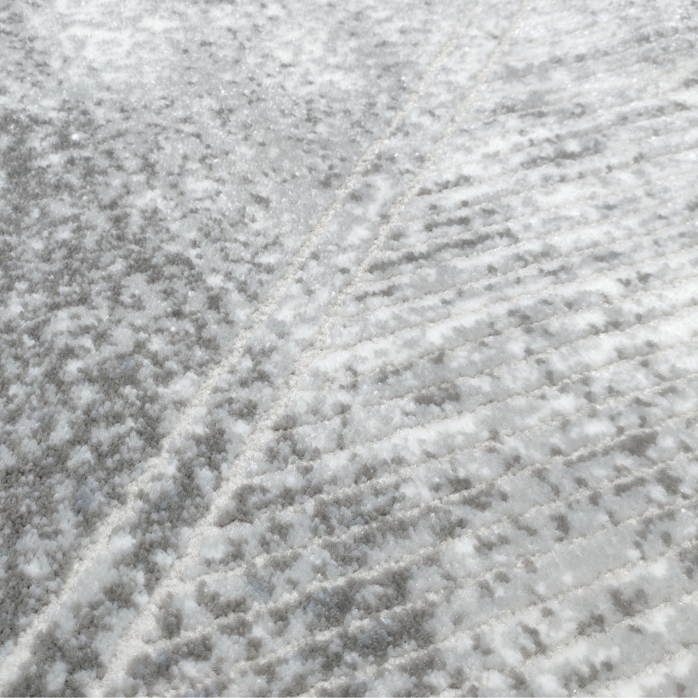 Wynn Abstract Textured Rug in soft gray and blue, perfect for modern decor.