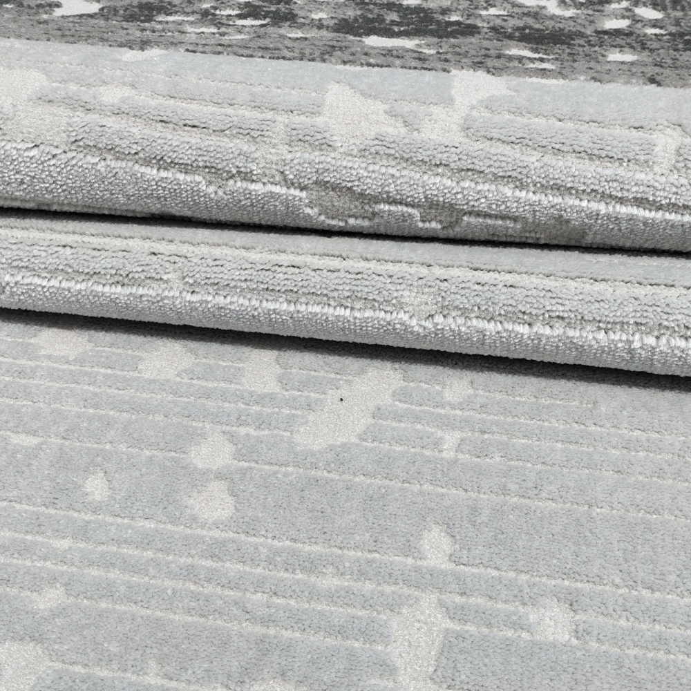 Freya Abstract Textured Rug in gray and silver, soft and machine washable.