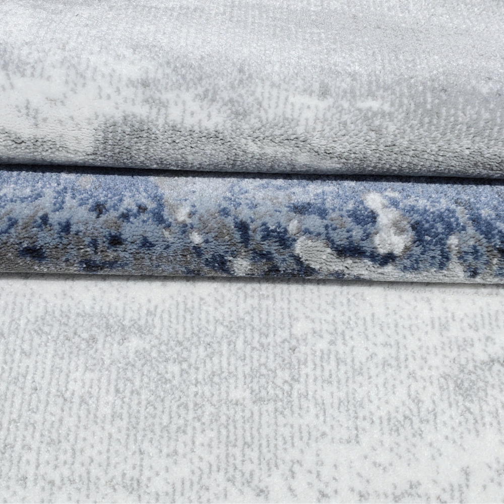 Gavin Abstract Textured Rug with gray and blue patterns for contemporary interiors.
