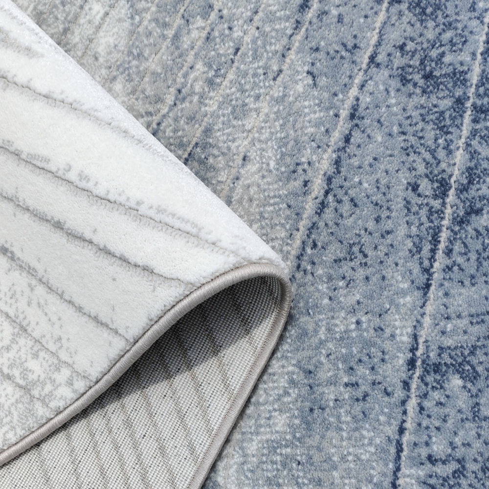 Mia Abstract Textured Rug in blue and grey with wave pattern detail