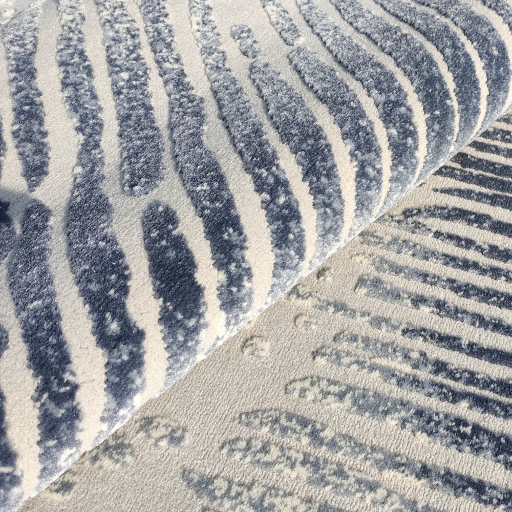 Calla Abstract Textured Rug featuring blue and beige stripes for contemporary decor
