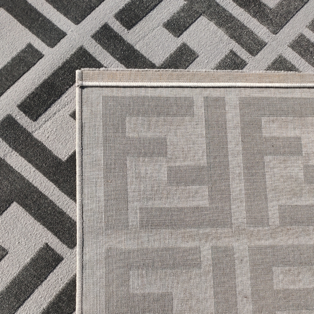 Stylish gray geometric rug with interlocking pattern, ideal for contemporary decor.