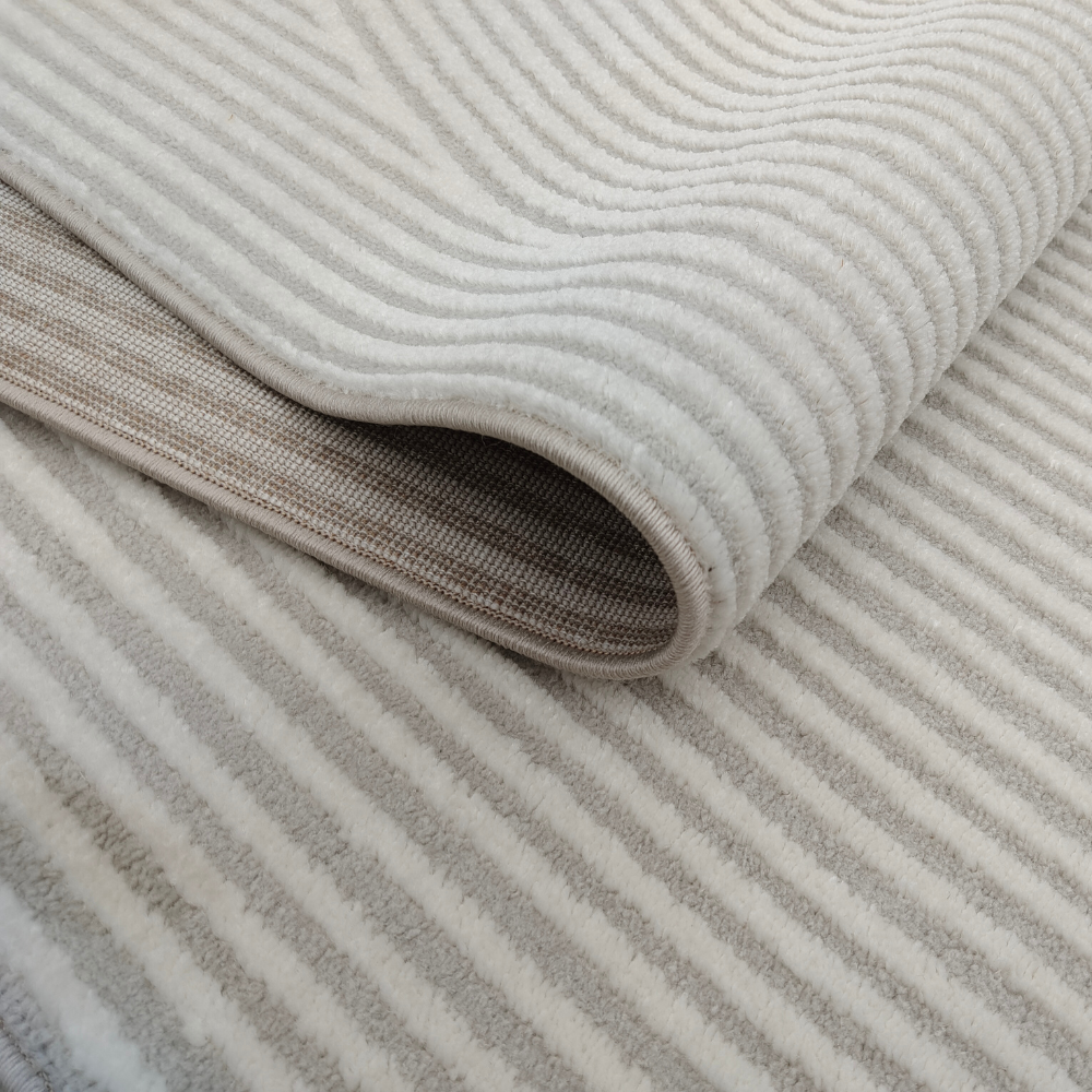 Elowen Stripes Textured Rug close-up in soft neutral tones with elegant stripes.