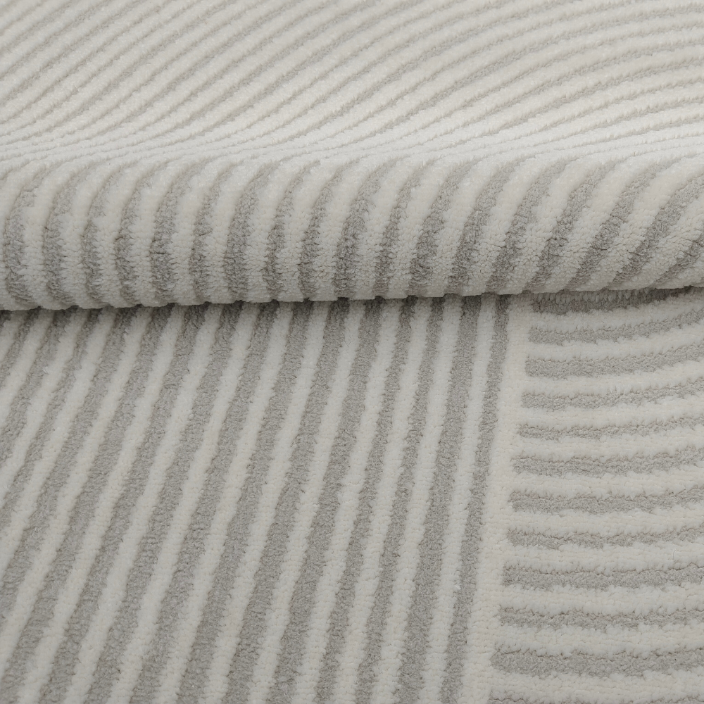 Elowen Stripes Textured Rug showcasing soft stripes in neutral shades.