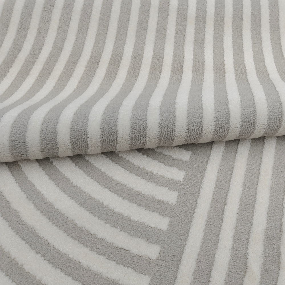 Vero textured rug with soft grey and cream stripes, perfect for stylish home decor.
