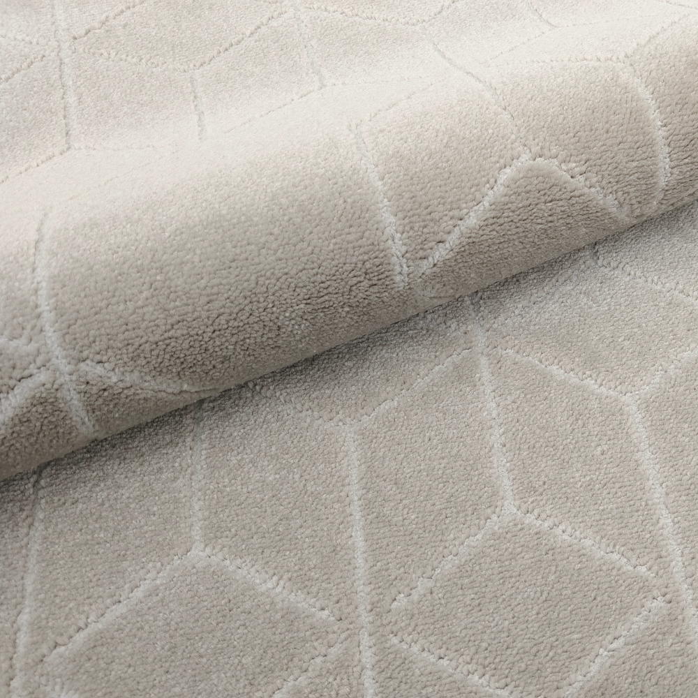 Peregrine geometric textured rug in soft neutral color with hexagonal pattern