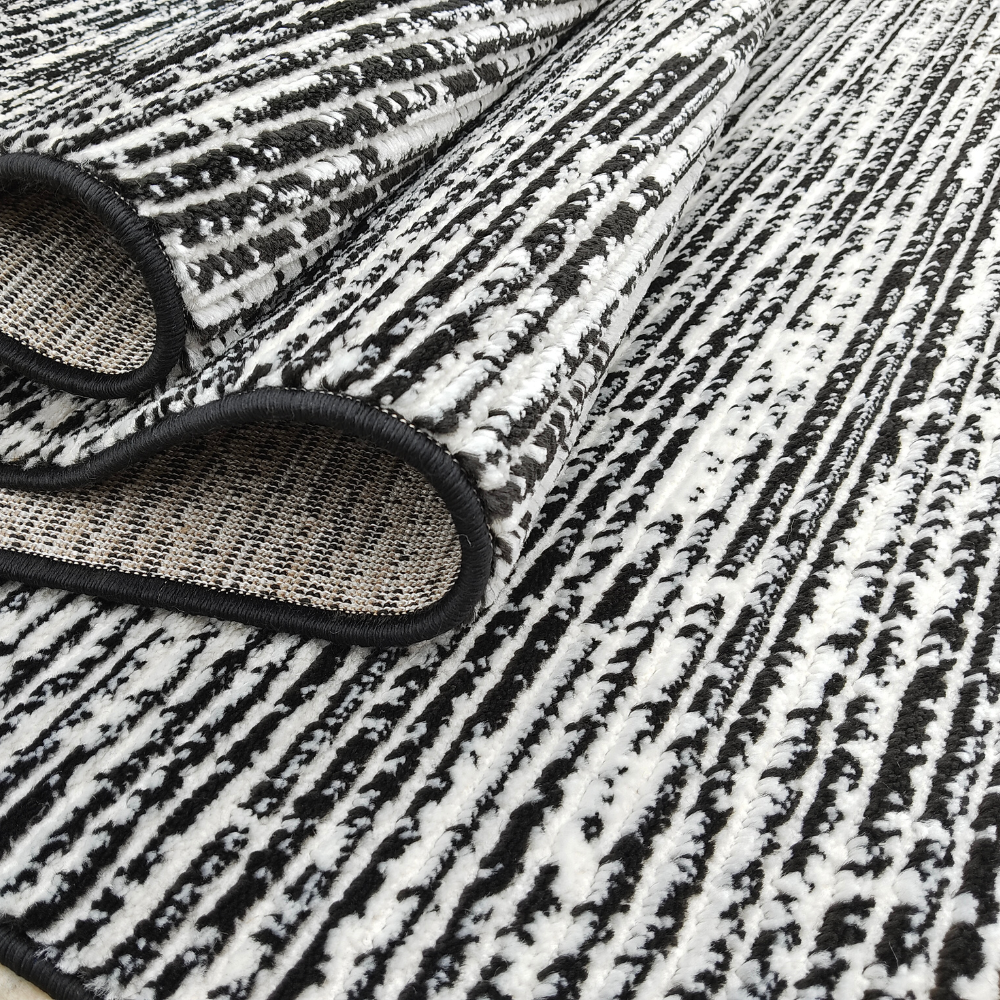 Seraphina Stripes Textured Rug in black and white, ideal for contemporary home design.