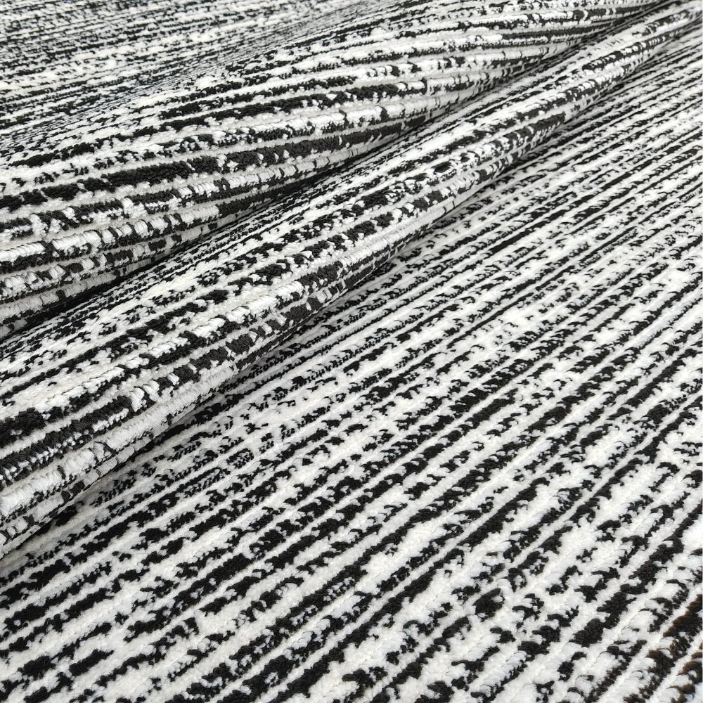 Seraphina Stripes Textured Rug in black and white, great for chic home aesthetics.
